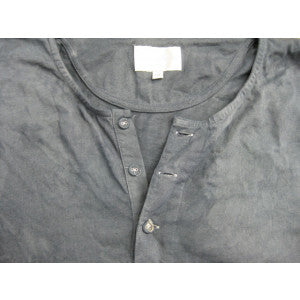 Dyed vest with covered buttons